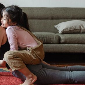 mom-daughter-performing-yoga-together-1475x475