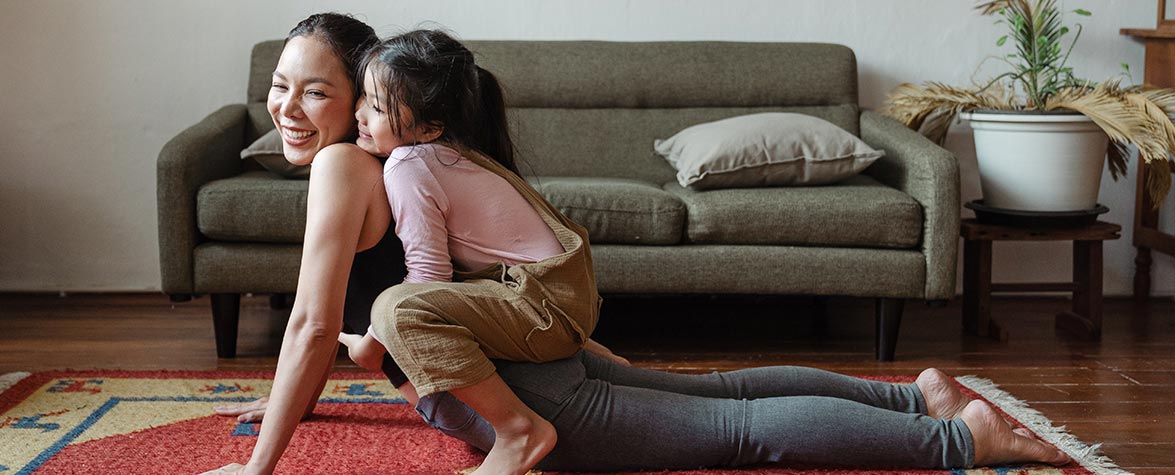 mom-daughter-performing-yoga-together-1475x475